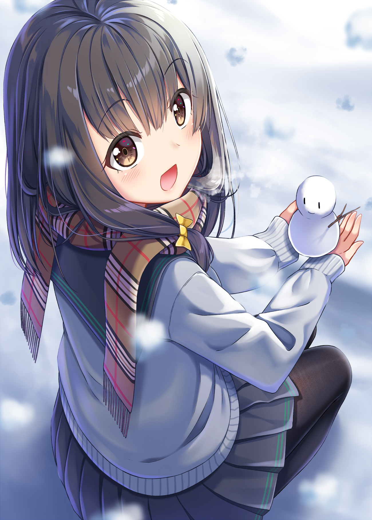 Girl holding snowman